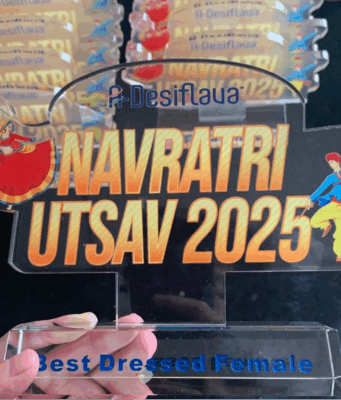 The Grand Finale: An Epic Garba Night & Championship Garba dancers performing in colorful traditional outfits at A-Desiflava Navratri Utsav 2025 in Hong Kong