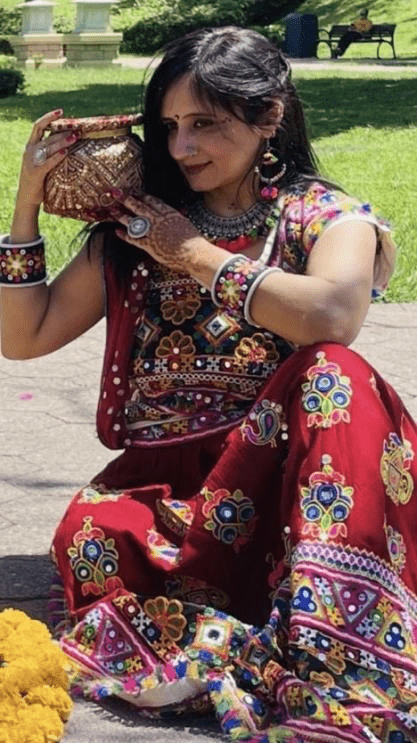 Garba dancers performing in colorful traditional outfits at A-Desiflava Navratri Utsav 2024 in Hong Kong