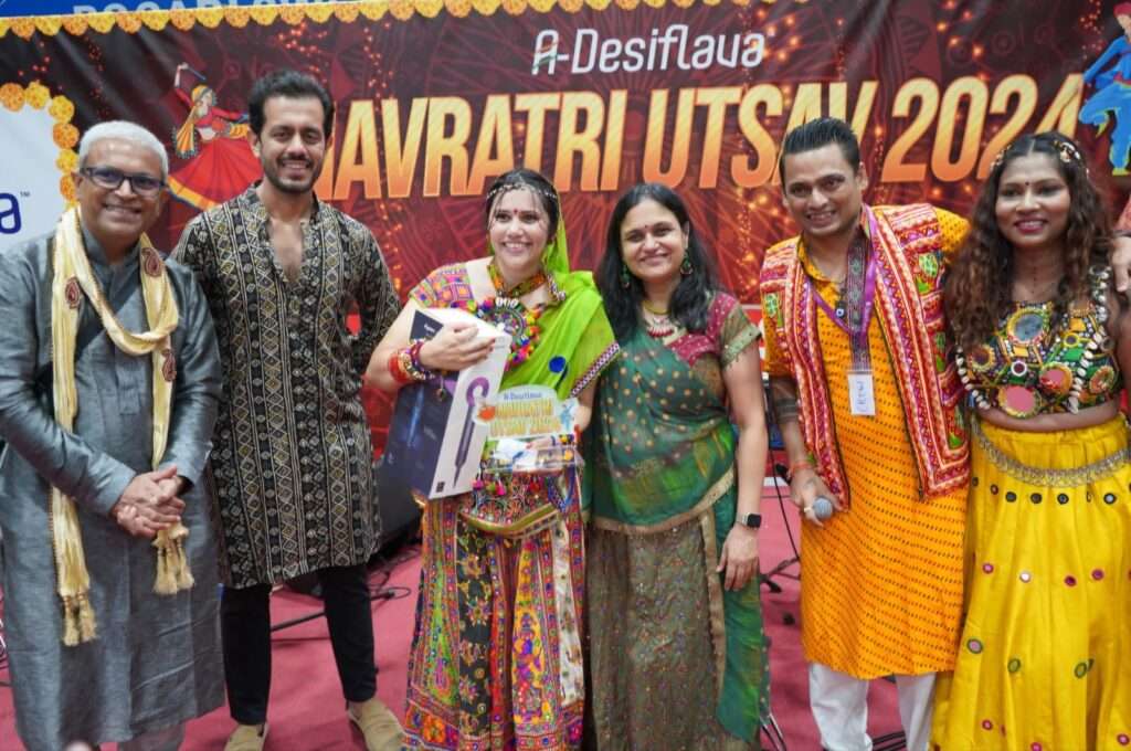 Garba dancers performing in colorful traditional outfits at A-Desiflava Navratri Utsav 2024 in Hong Kong