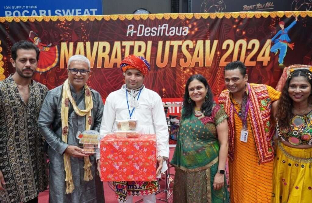 Garba dancers performing in colorful traditional outfits at A-Desiflava Navratri Utsav 2024 in Hong Kong