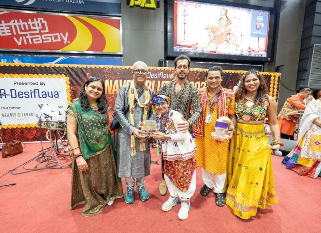 Garba dancers performing in colorful traditional outfits at A-Desiflava Navratri Utsav 2024 in Hong Kong