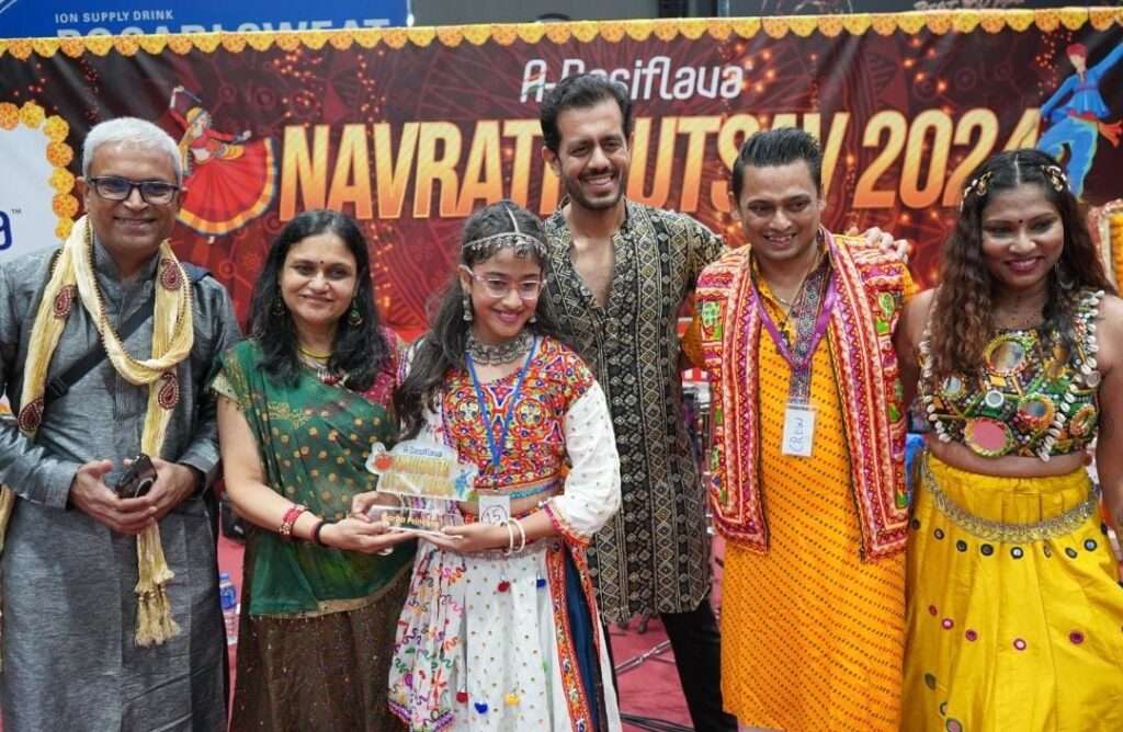 Garba dancers performing in colorful traditional outfits at A-Desiflava Navratri Utsav 2024 in Hong Kong